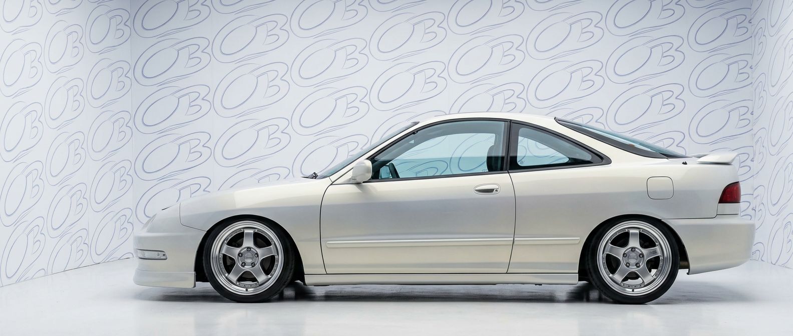 Professional automotive photography of a 1999 Acura Integra with high-fidelity 1999.