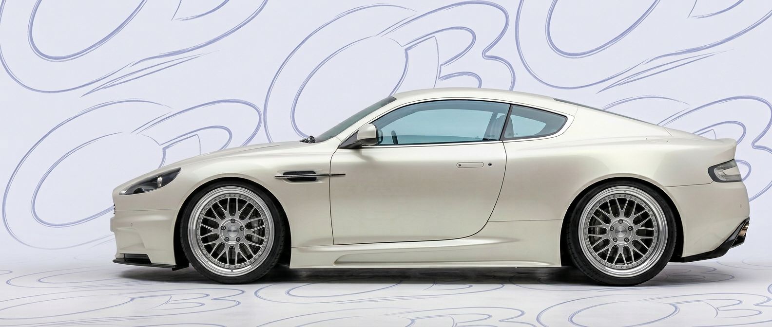 Aston Martin DB9 2009 - Bodykits, Bumpers, Fenders and more... Front-angle view of 2009 Aston Martin DB9 2009 - Durable and stylish exterior enhancement.