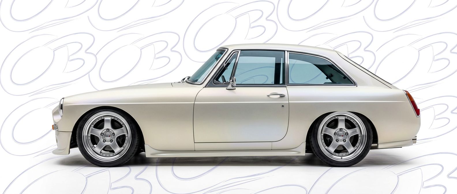 Professional automotive photography of a 1965 BMC MGB with high-fidelity 1965.