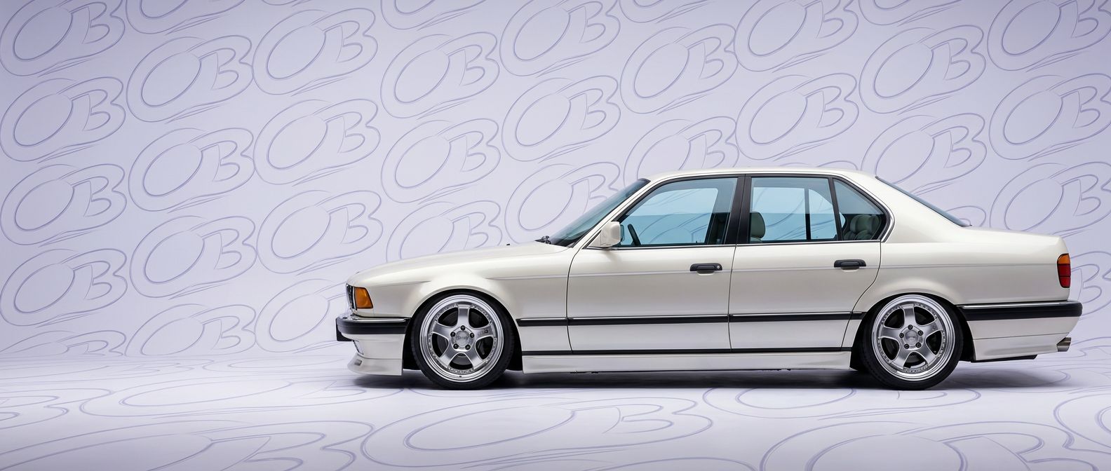 Top-tier 1990 BMW 7-Series 1990 featuring a high-gloss finish and carbon fiber weave.