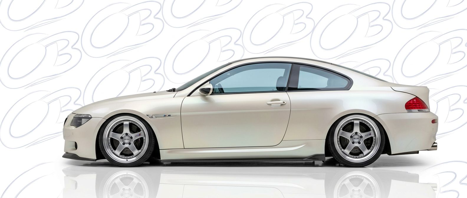 Top-tier 2011 BMW M6 2011 featuring a high-gloss finish and carbon fiber weave.