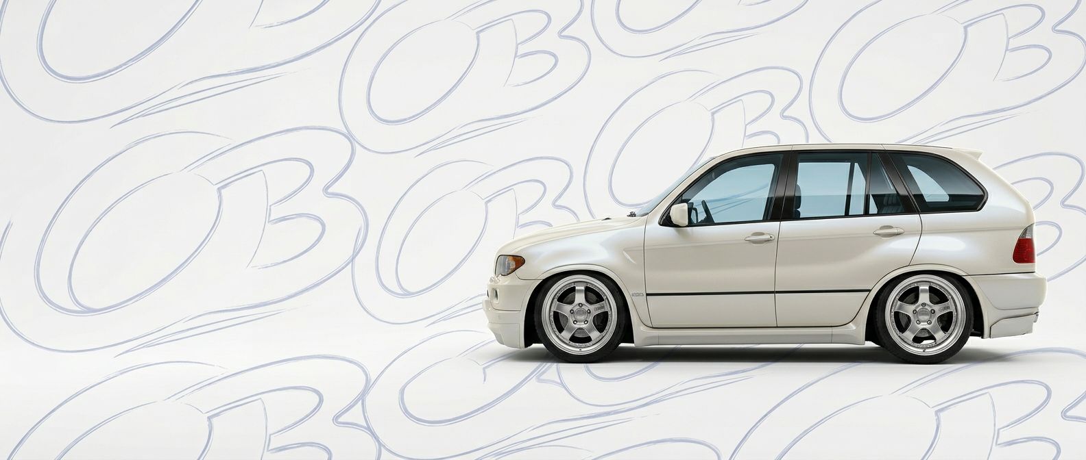 Professional automotive photography of a 2003 BMW X5 with high-fidelity 2003.