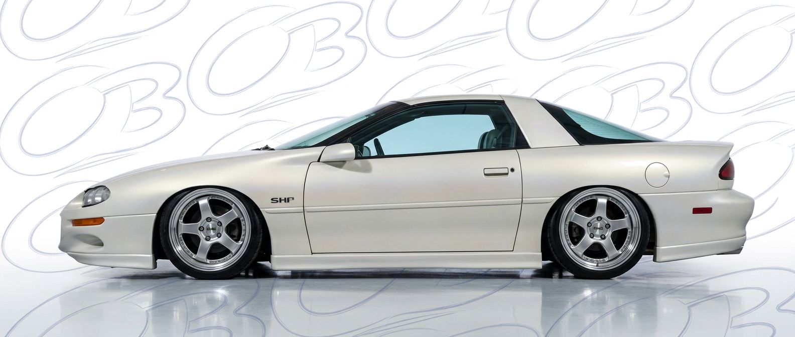 Professional automotive photography of a 1999 Chevrolet Camaro with high-fidelity 1999.