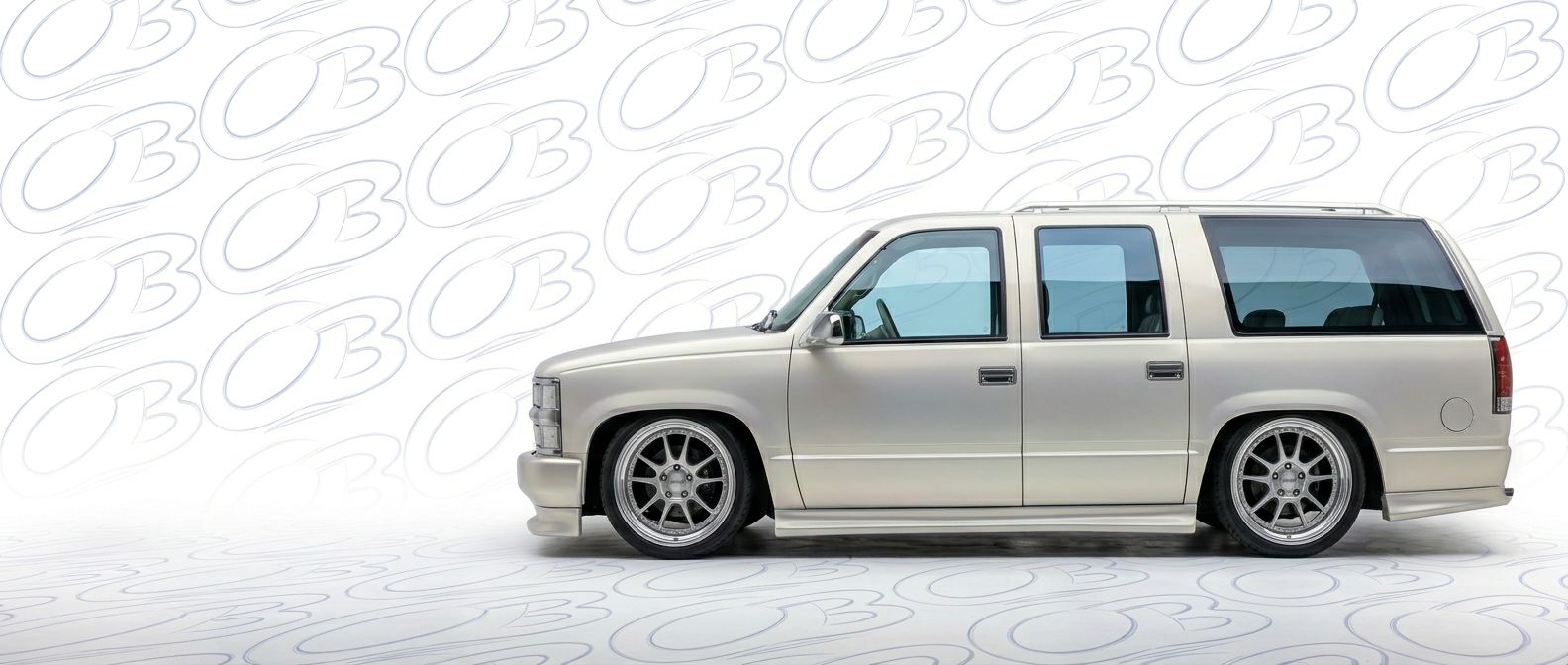 Professional automotive photography of a 1999 Chevrolet Suburban with high-fidelity 1999.