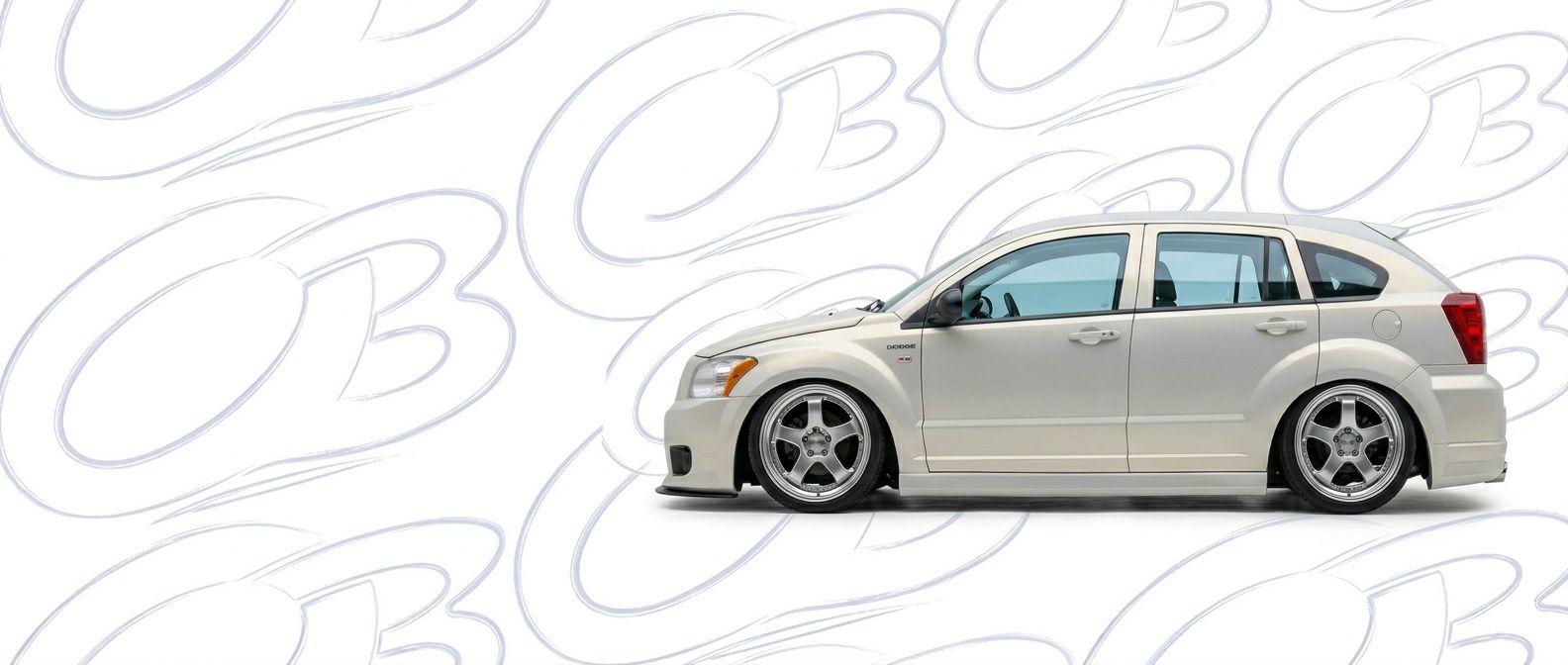 Top-tier 2010 Dodge Caliber 2010 featuring a high-gloss finish and carbon fiber weave.