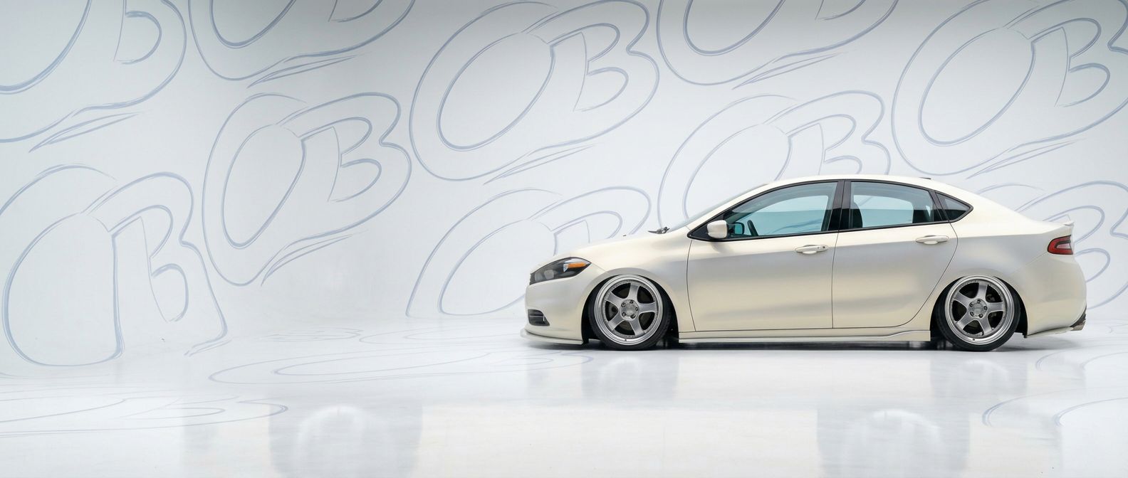 Professional automotive photography of a 2015 Dodge Dart with high-fidelity 2015.