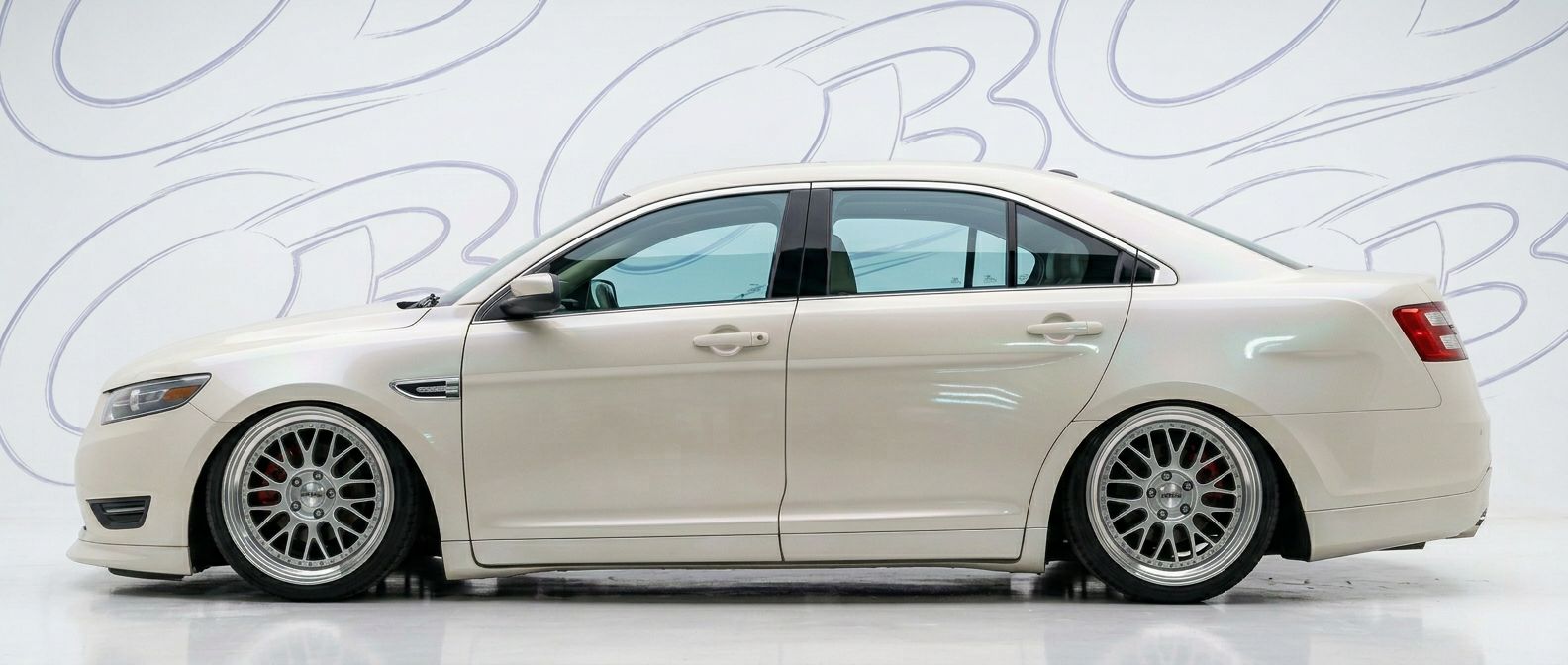 Top-tier 2013 Ford Taurus 2013 featuring a high-gloss finish and carbon fiber weave.