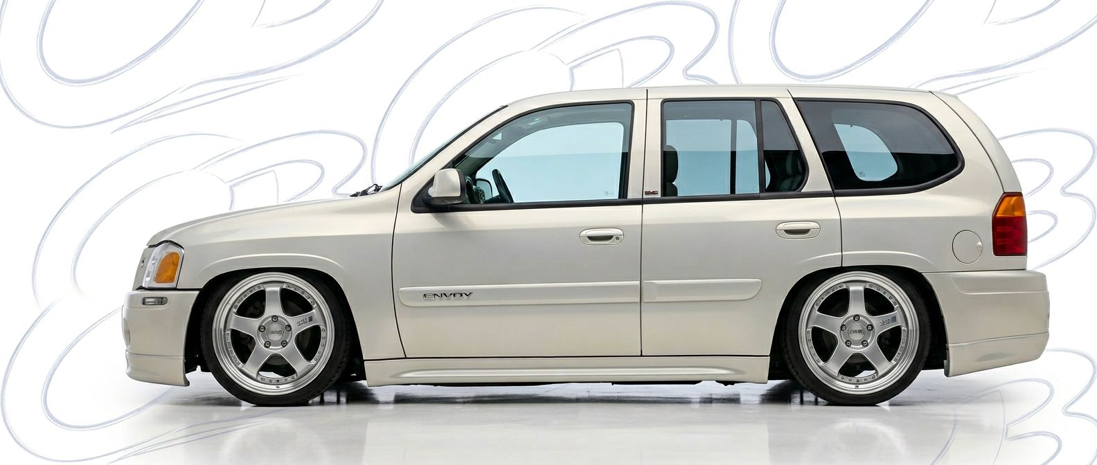 Top-tier 2003 GMC Envoy 2003 featuring a high-gloss finish and carbon fiber weave.