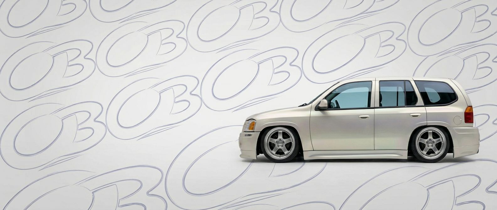 Top-tier 2006 GMC Envoy 2006 featuring a high-gloss finish and carbon fiber weave.