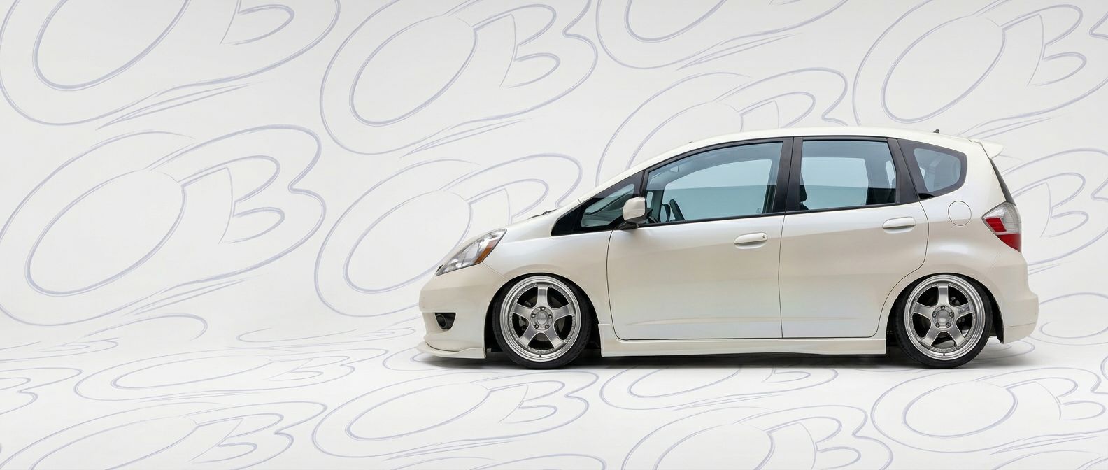 Professional automotive photography of a 2012 Honda Fit with high-fidelity 2012.