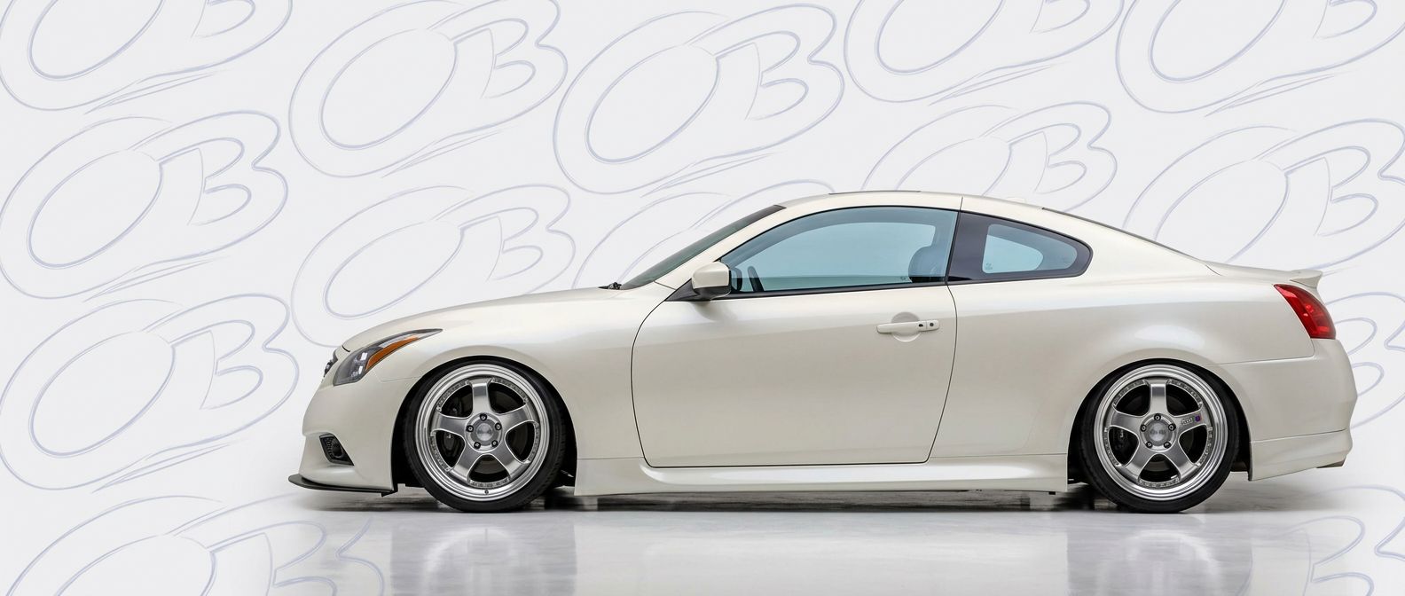 Top-tier  Infiniti  Infiniti featuring a high-gloss finish and carbon fiber weave.