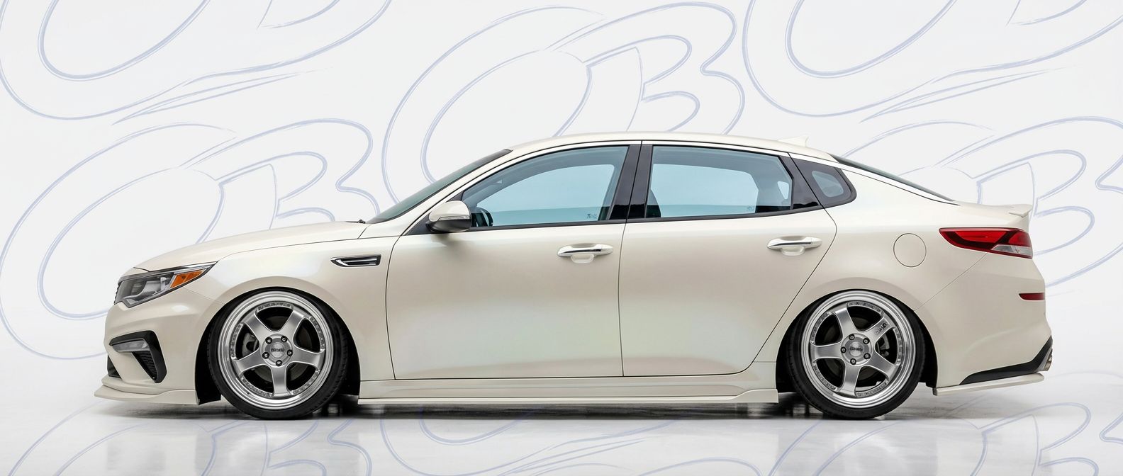 Top-tier  KIA Optima Optima featuring a high-gloss finish and carbon fiber weave.