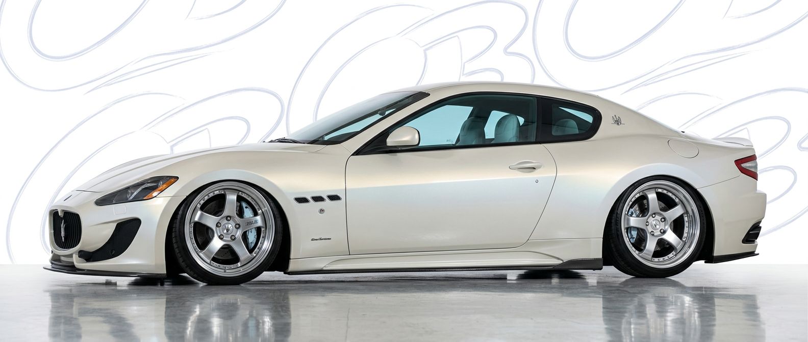 Front-angle view of  Maserati GranTurismo GranTurismo - Durable and stylish exterior enhancement.
