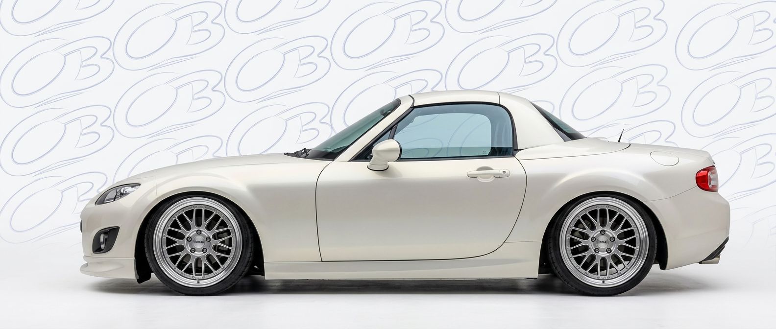 Professional automotive photography of a 2011 Mazda Miata with high-fidelity 2011.