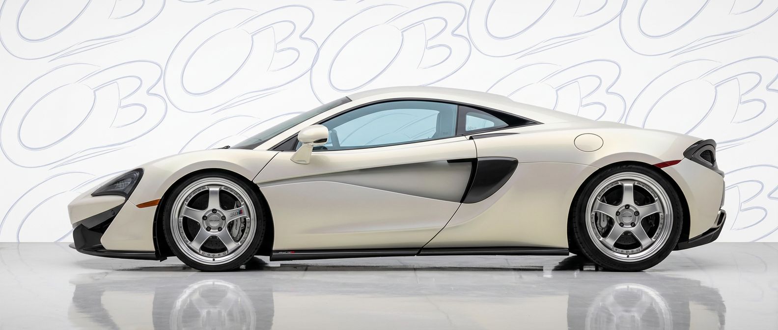 Professional automotive photography of a  McLaren 570S with high-fidelity 570S.