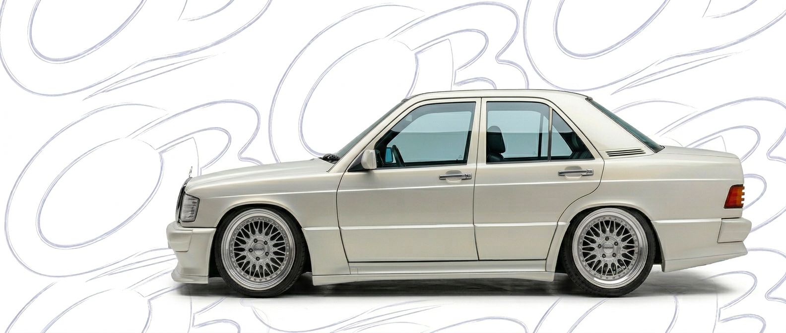 Professional automotive photography of a 1989 Mercedes-Benz 190 with high-fidelity 1989.