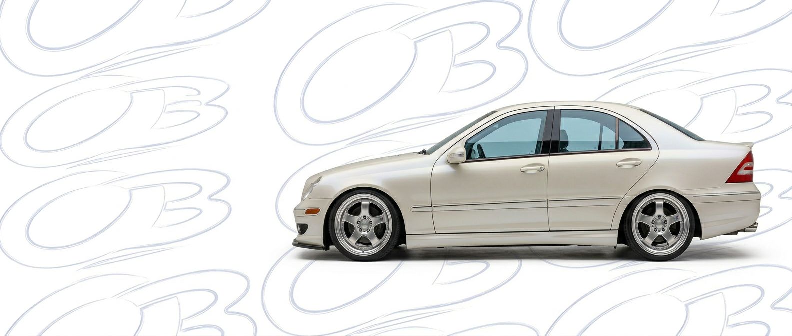 Top-tier 2005 Mercedes-Benz C230 2005 featuring a high-gloss finish and carbon fiber weave.