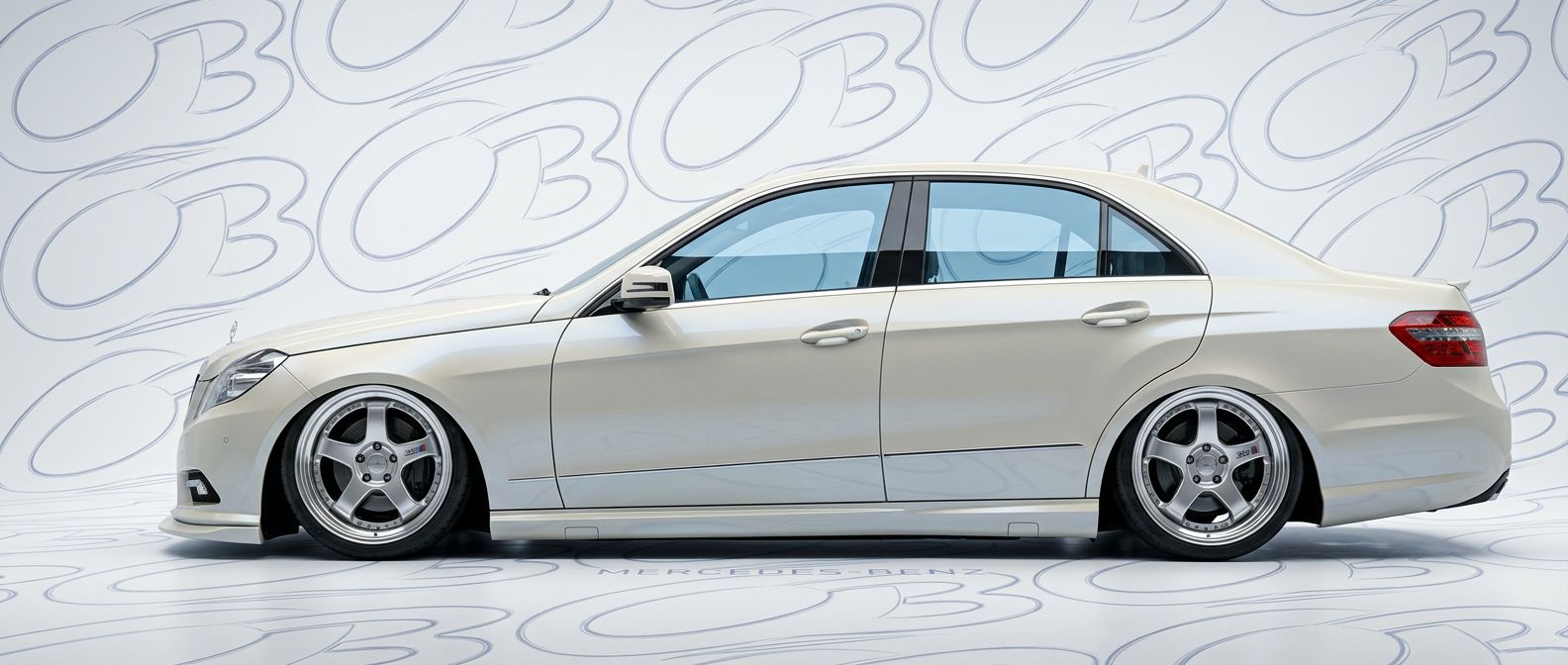 Top-tier 2010 Mercedes-Benz E-Class 2010 featuring a high-gloss finish and carbon fiber weave.