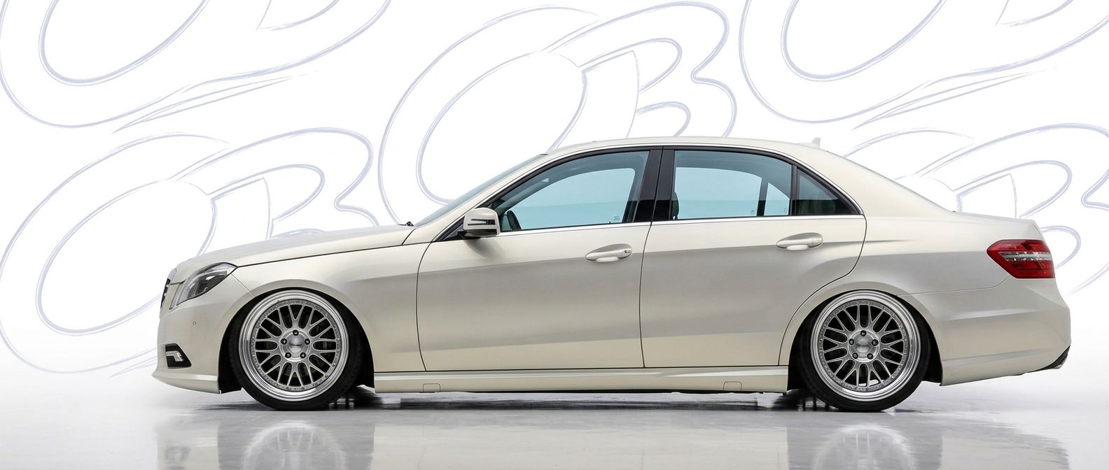 Top-tier 2013 Mercedes-Benz E-Class 2013 featuring a high-gloss finish and carbon fiber weave.