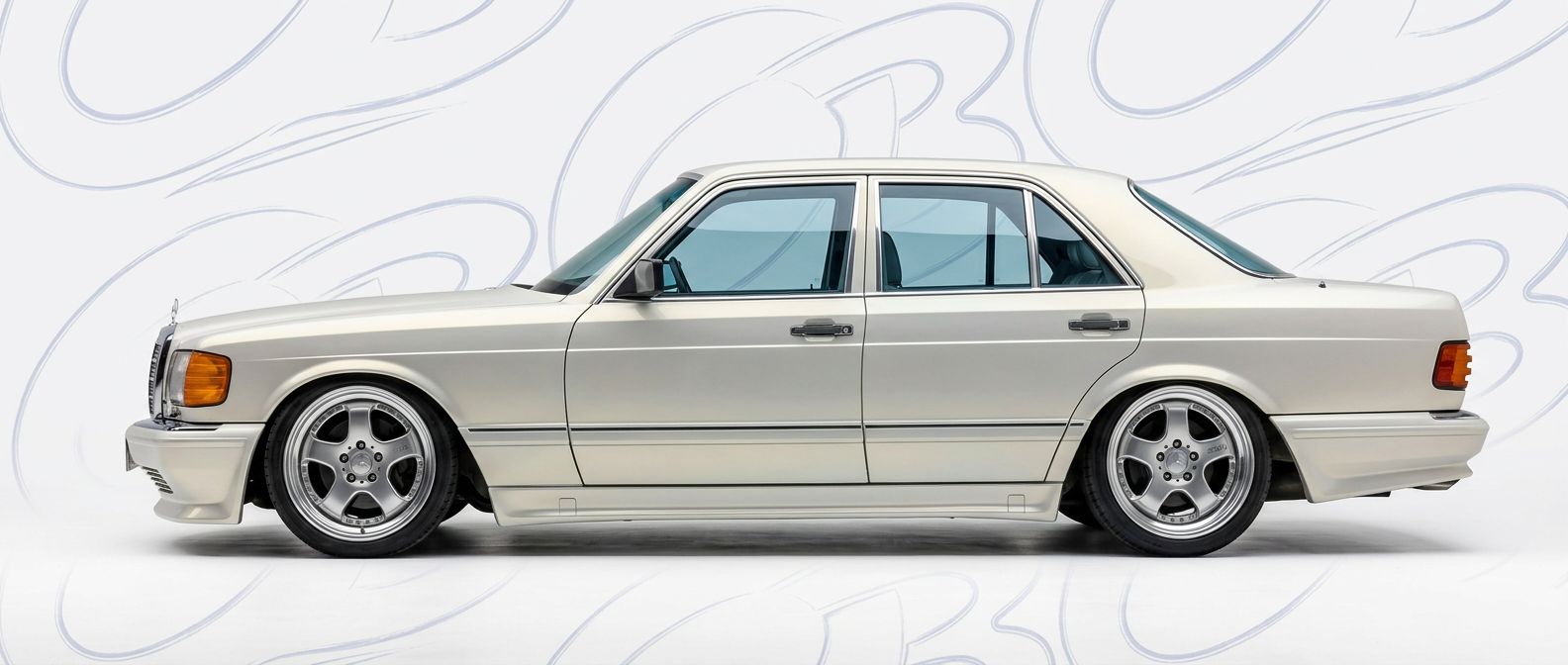 Professional automotive photography of a 1984 Mercedes-Benz S-Class with high-fidelity 1984.