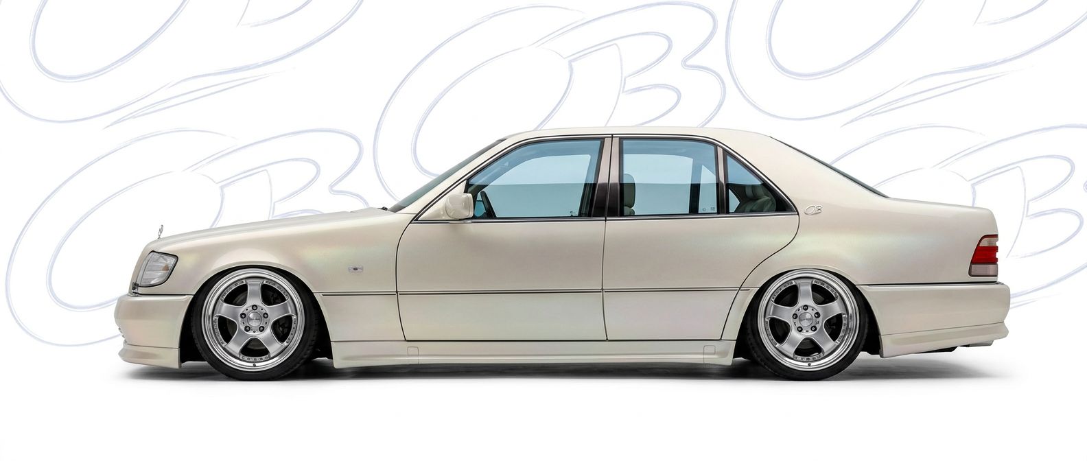 Professional automotive photography of a 1992 Mercedes-Benz S-Class with high-fidelity 1992.