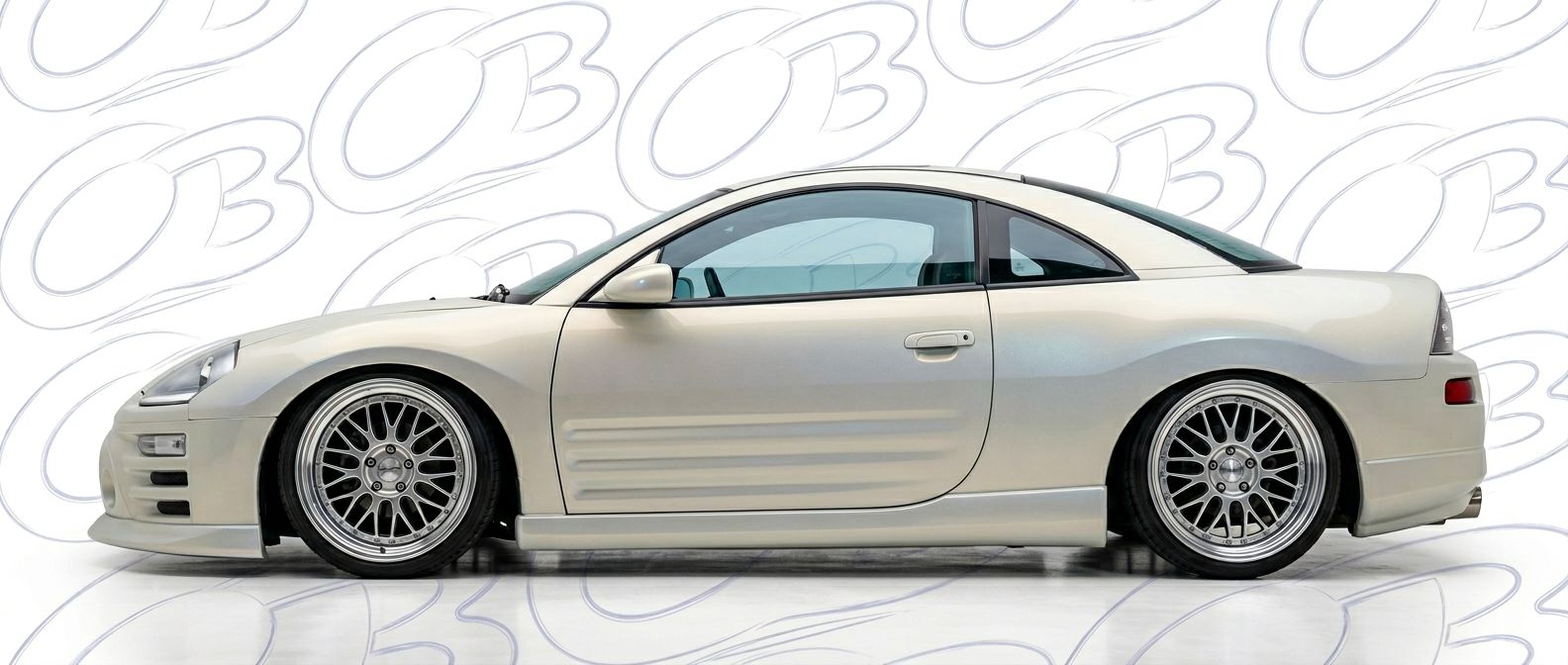 Professional automotive photography of a 2003 Mitsubishi Eclipse with high-fidelity 2003.