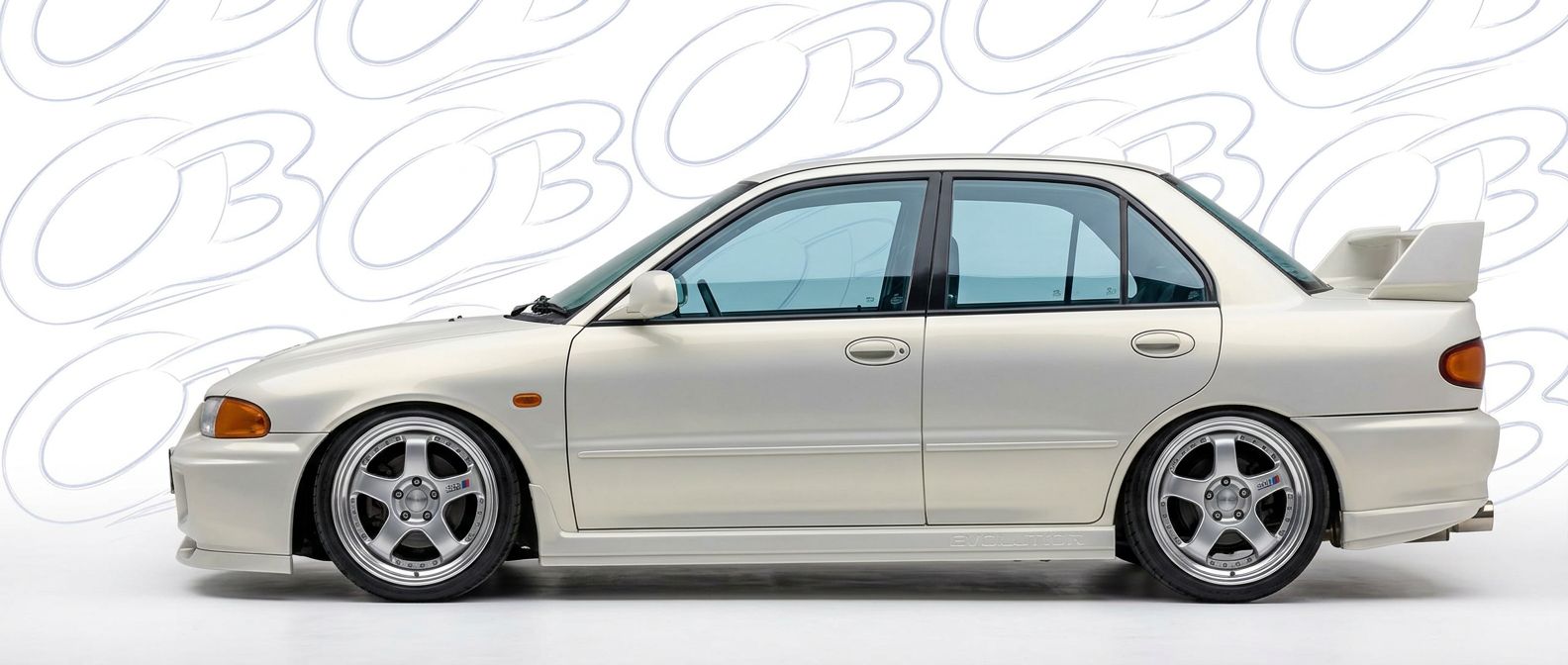 Professional automotive photography of a 1992 Mitsubishi Evolution with high-fidelity 1992.