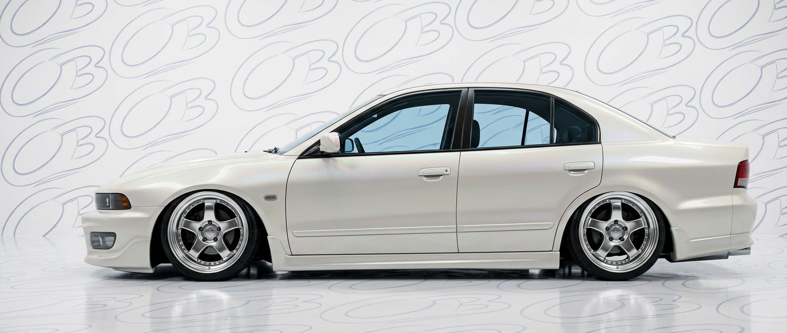 Top-tier  Mitsubishi Galant Galant featuring a high-gloss finish and carbon fiber weave.