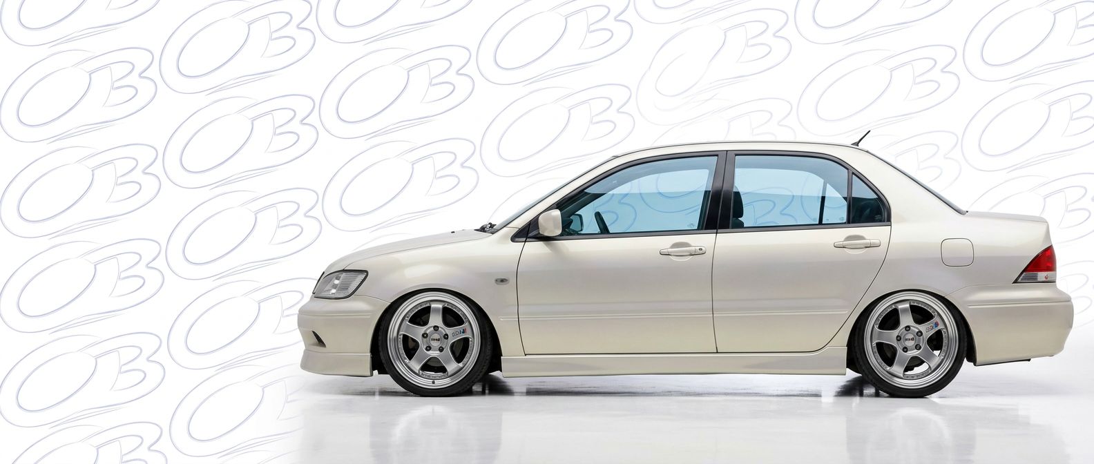 Top-tier 2002 Mitsubishi Lancer 2002 featuring a high-gloss finish and carbon fiber weave.
