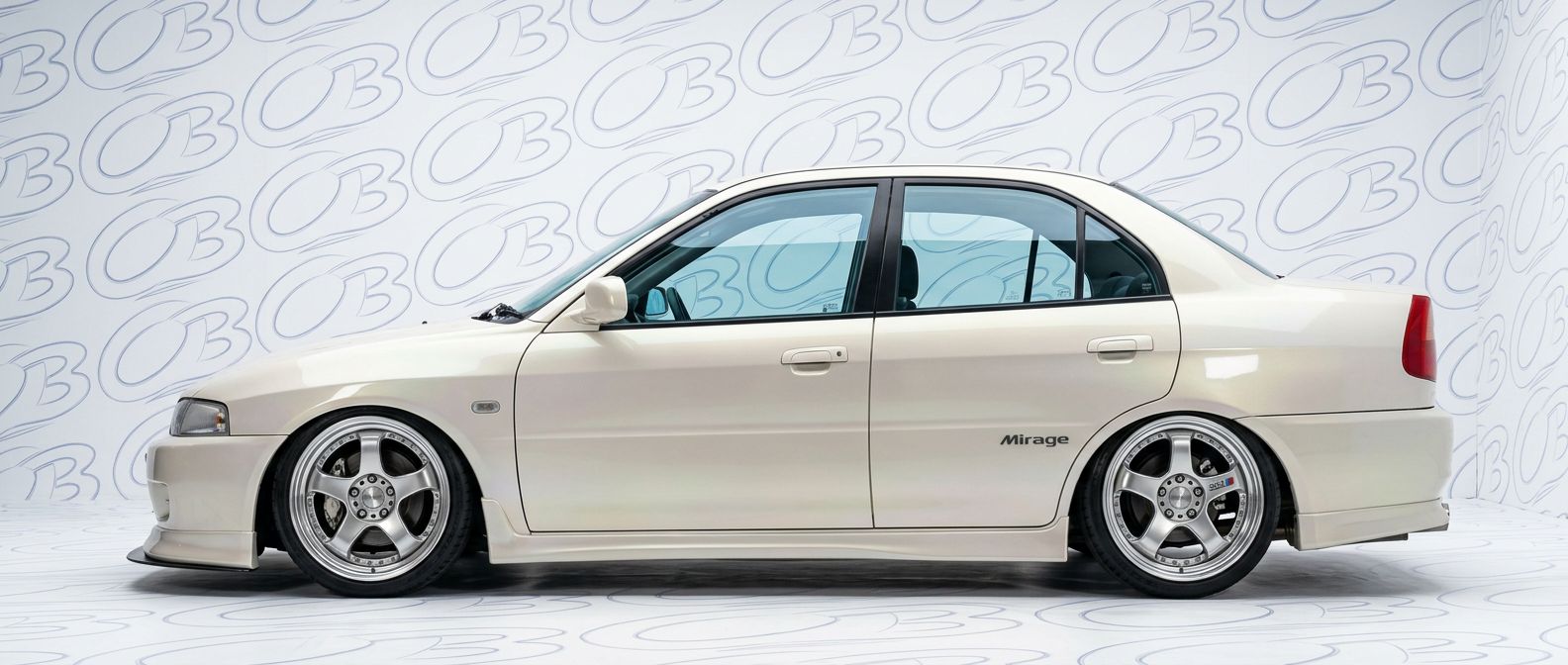 Professional automotive photography of a 2000 Mitsubishi Mirage with high-fidelity 2000.