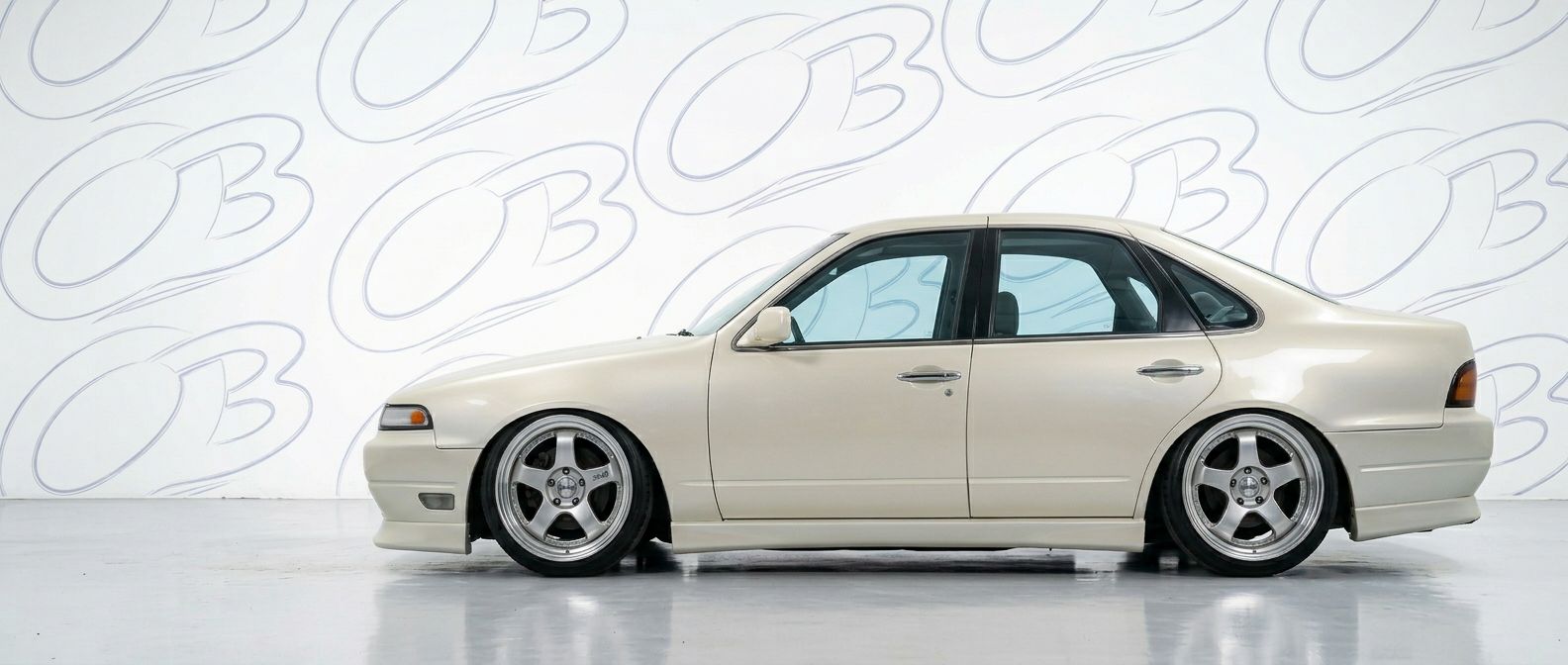 Top-tier 1991 Nissan Cefiro 1991 featuring a high-gloss finish and carbon fiber weave.