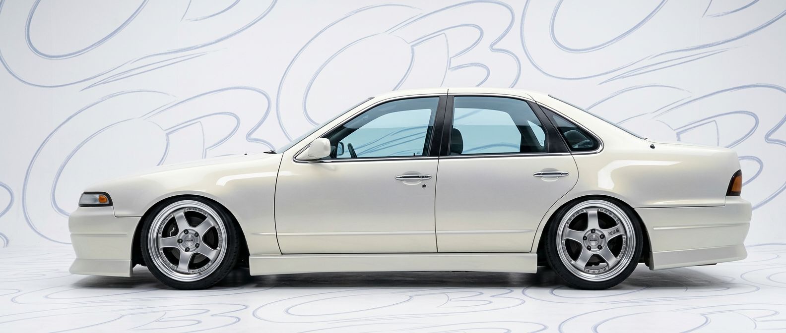 Professional automotive photography of a  Nissan Cefiro with high-fidelity Cefiro.