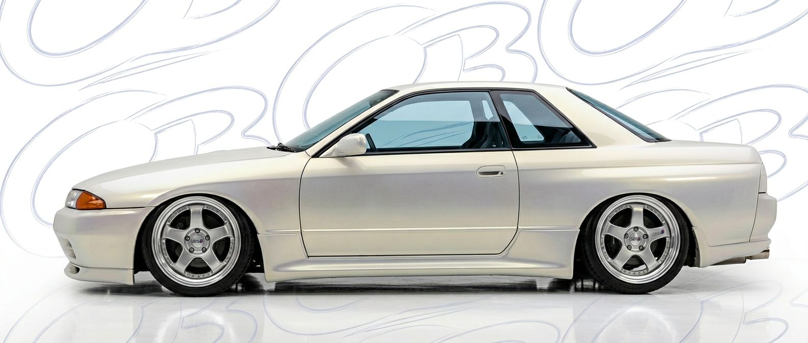 Professional automotive photography of a 1990 Nissan Skyline with high-fidelity 1990.