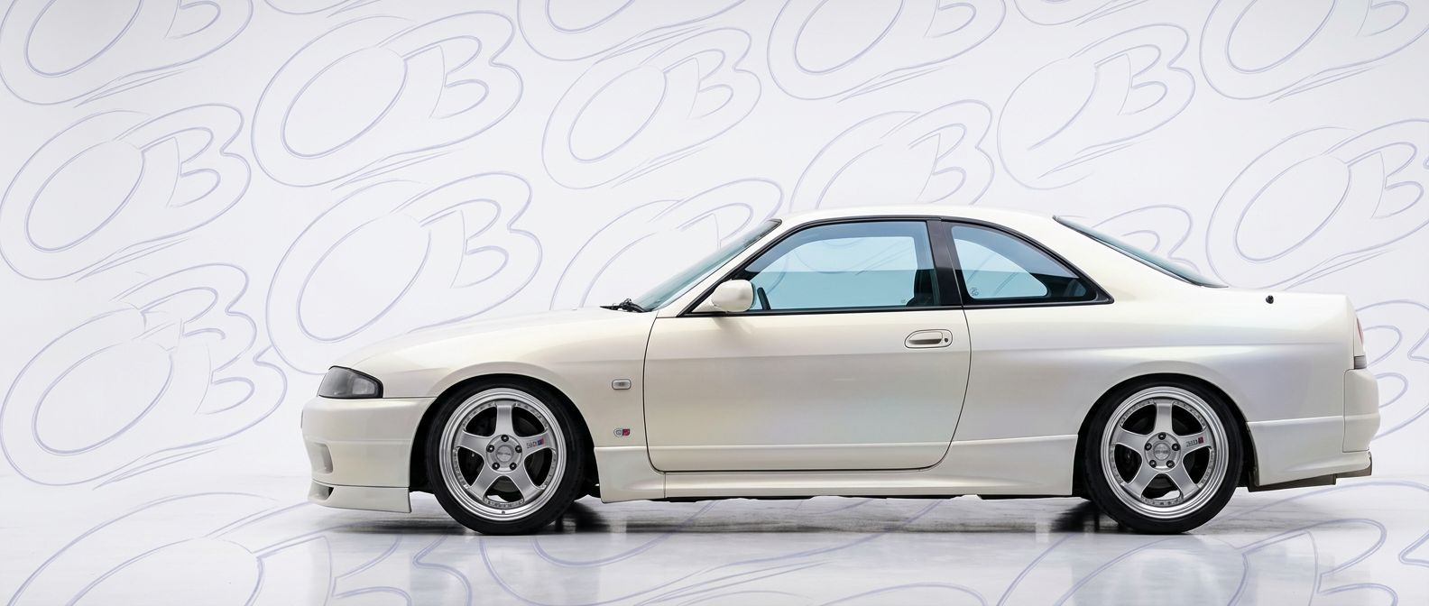 Top-tier  Nissan Skyline (R33) GTS Skyline (R33) GTS featuring a high-gloss finish and carbon fiber weave.