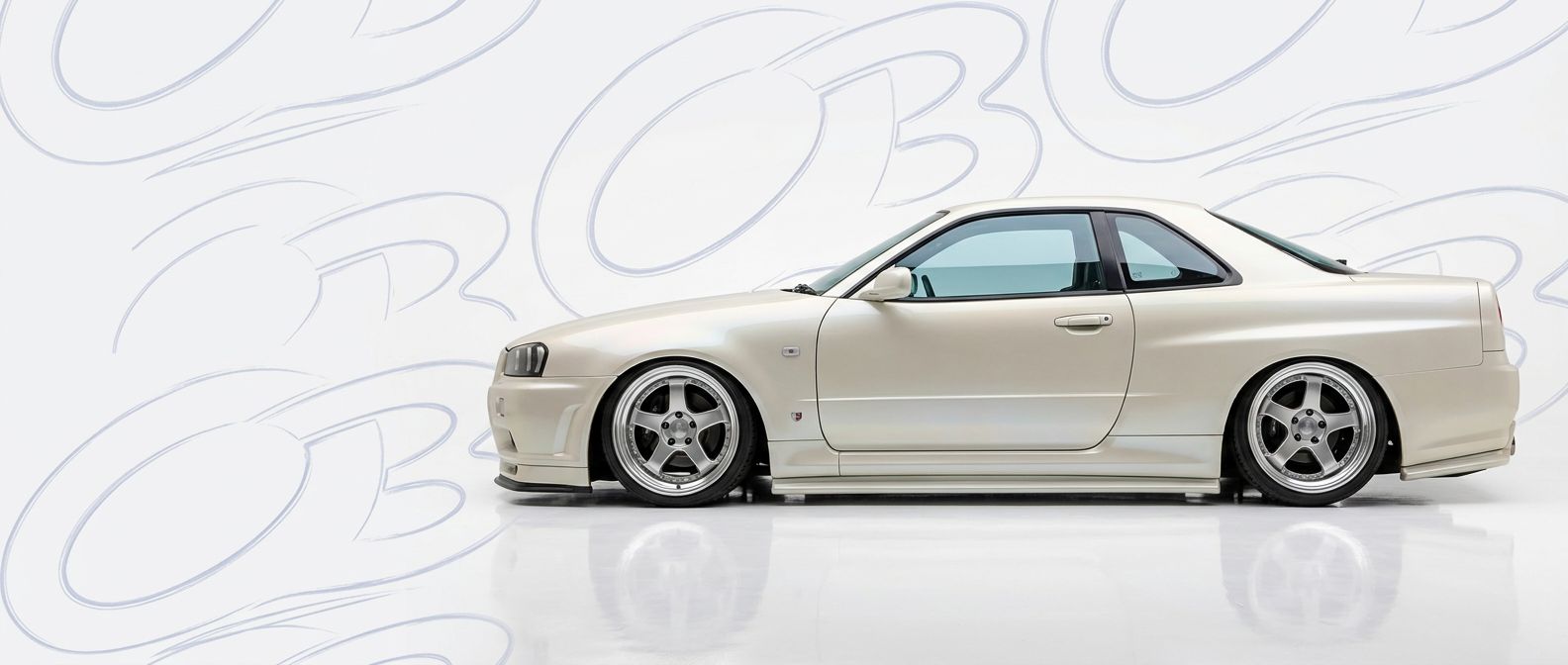 Professional automotive photography of a 2000 Nissan Skyline (R34) GTS with high-fidelity 2000.