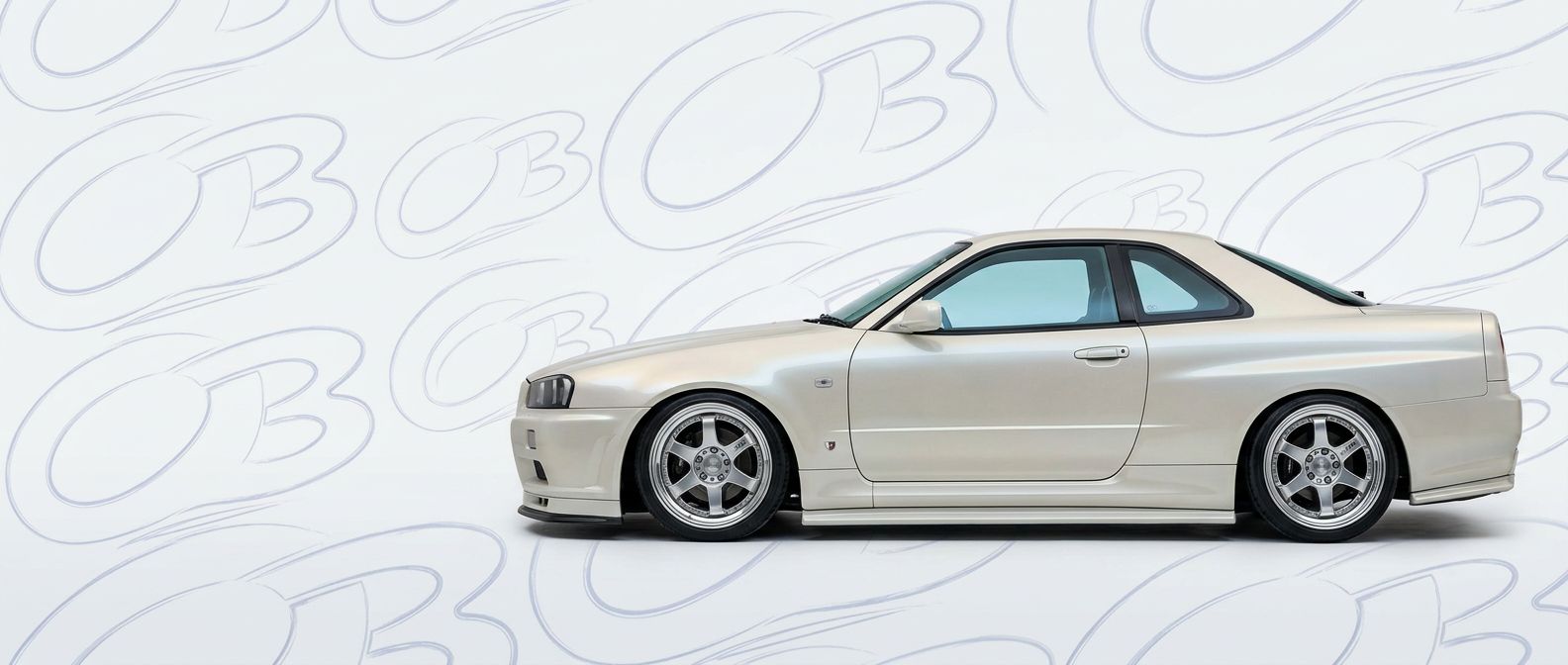 Professional automotive photography of a 1999 Nissan Skyline (R34) GTT with high-fidelity 1999.