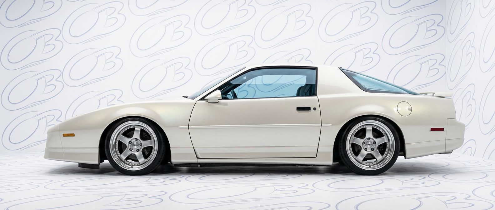 Front-angle view of 1990 Pontiac Firebird 1990 - Durable and stylish exterior enhancement.