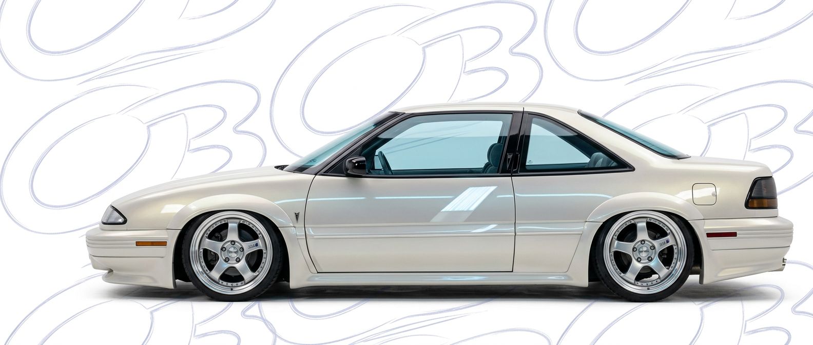 Professional automotive photography of a 1989 Pontiac Grand Prix with high-fidelity 1989.