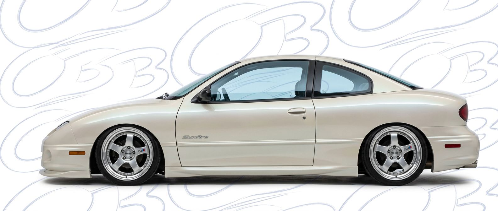 Top-tier 2002 Pontiac Sunfire 2002 featuring a high-gloss finish and carbon fiber weave.