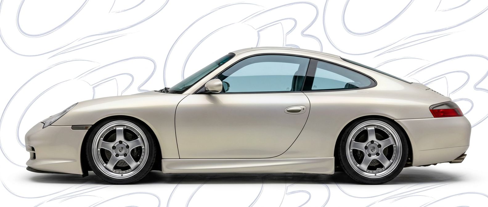 Top-tier 2000 Porsche 911 2000 featuring a high-gloss finish and carbon fiber weave.