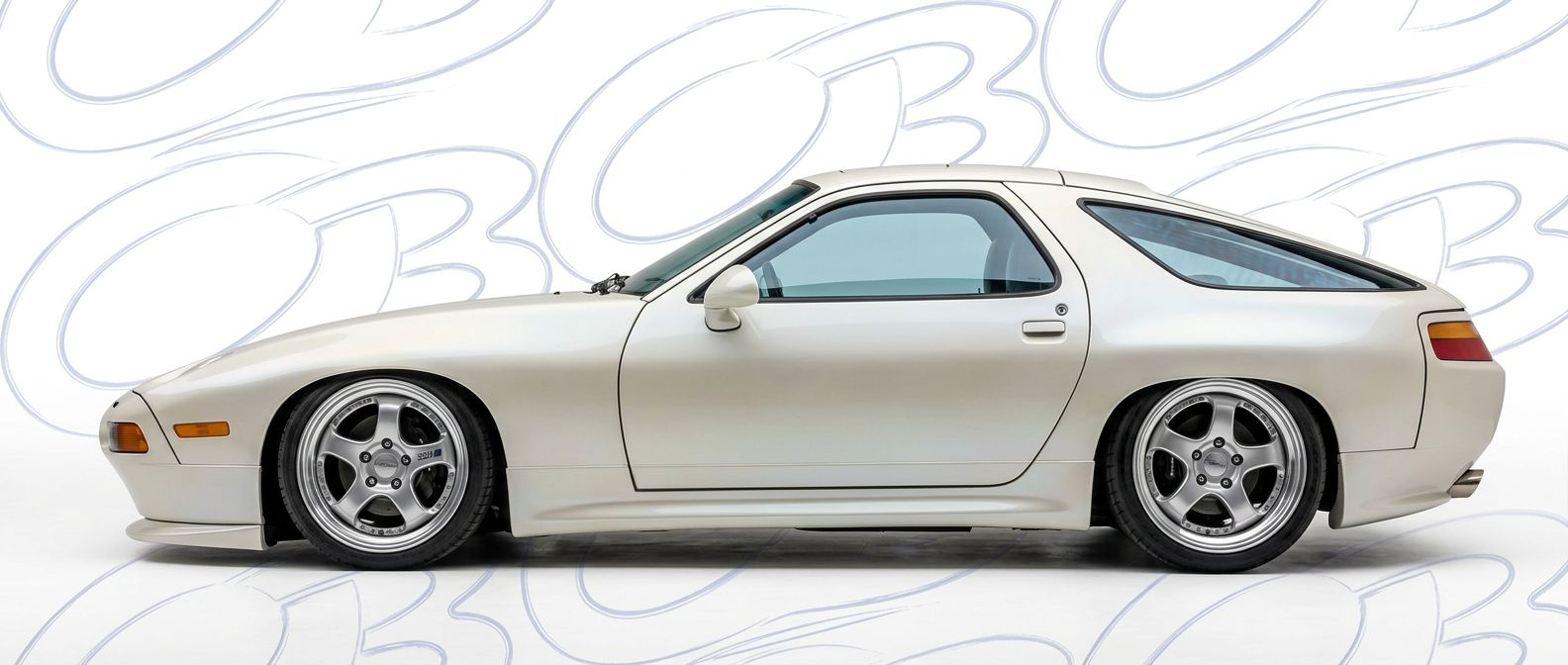 Professional automotive photography of a 1992 Porsche 928 with high-fidelity 1992.