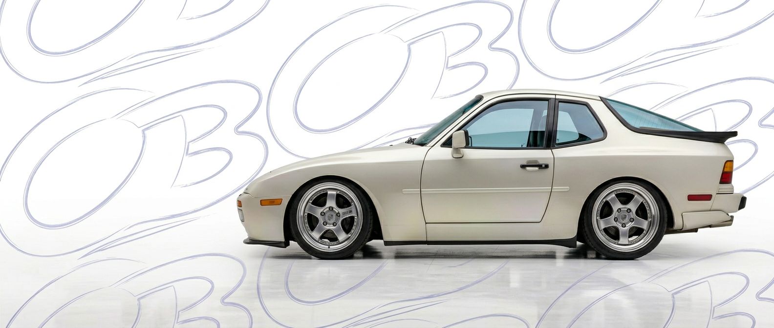 Professional automotive photography of a 1989 Porsche 944 with high-fidelity 1989.