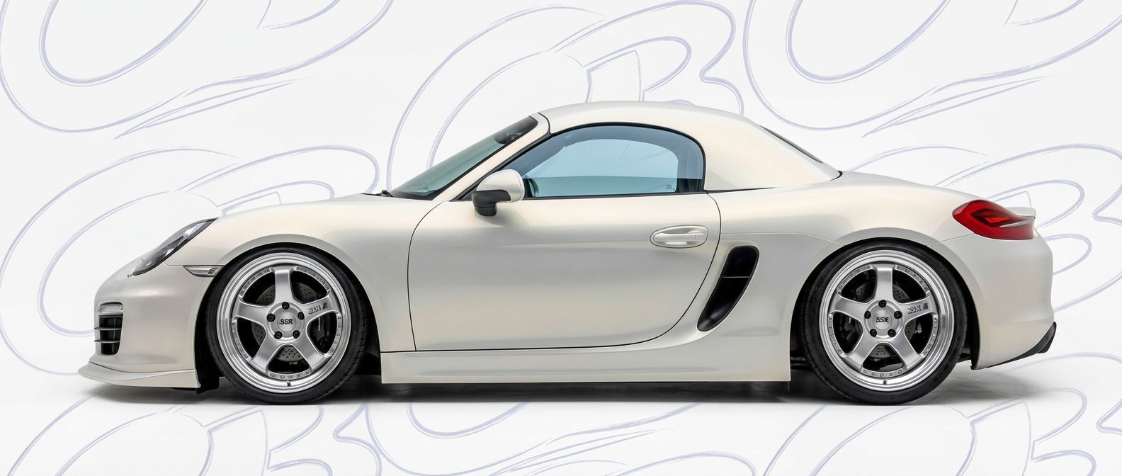 Professional automotive photography of a 2013 Porsche Boxster with high-fidelity 2013.