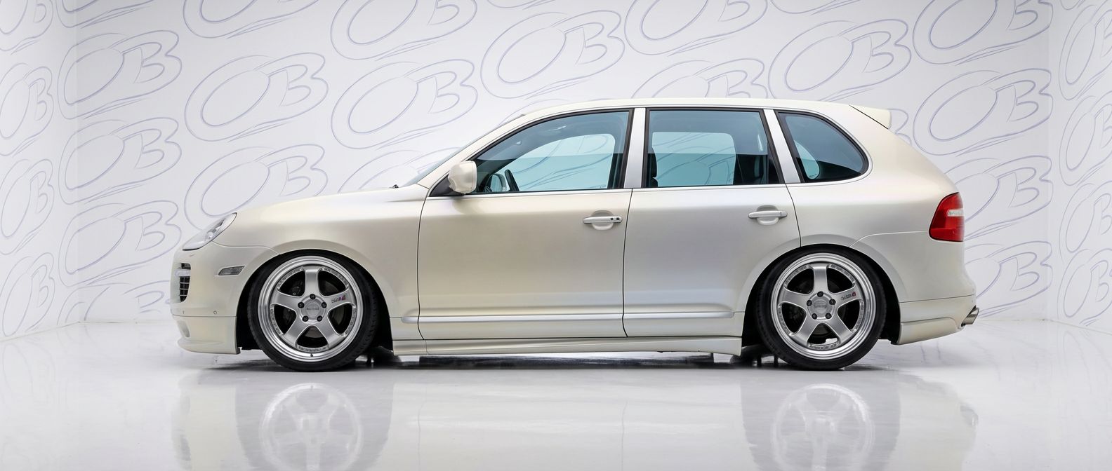 Top-tier 2010 Porsche Cayenne 2010 featuring a high-gloss finish and carbon fiber weave.