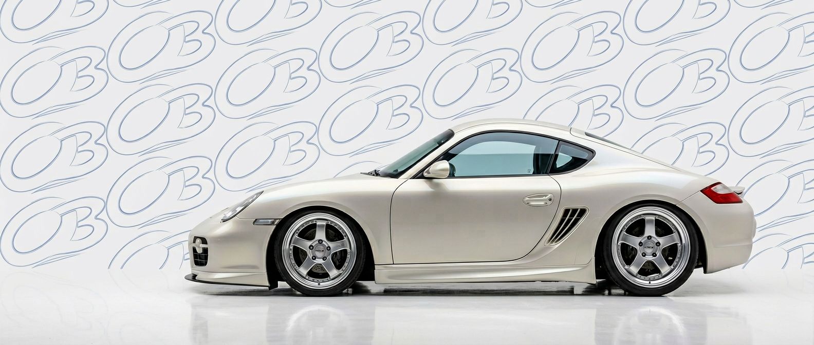 Top-tier 2009 Porsche Cayman 2009 featuring a high-gloss finish and carbon fiber weave.