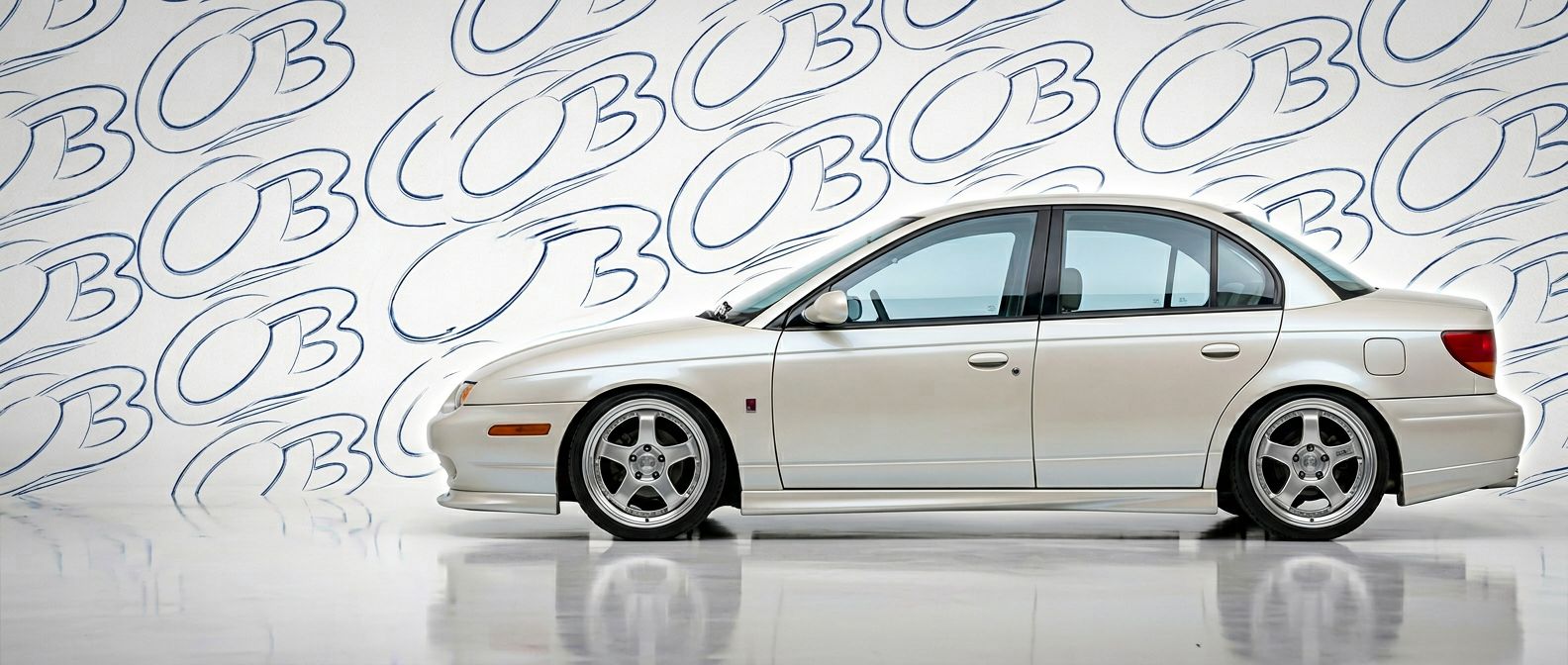 Professional automotive photography of a 2001 Saturn SL with high-fidelity 2001.