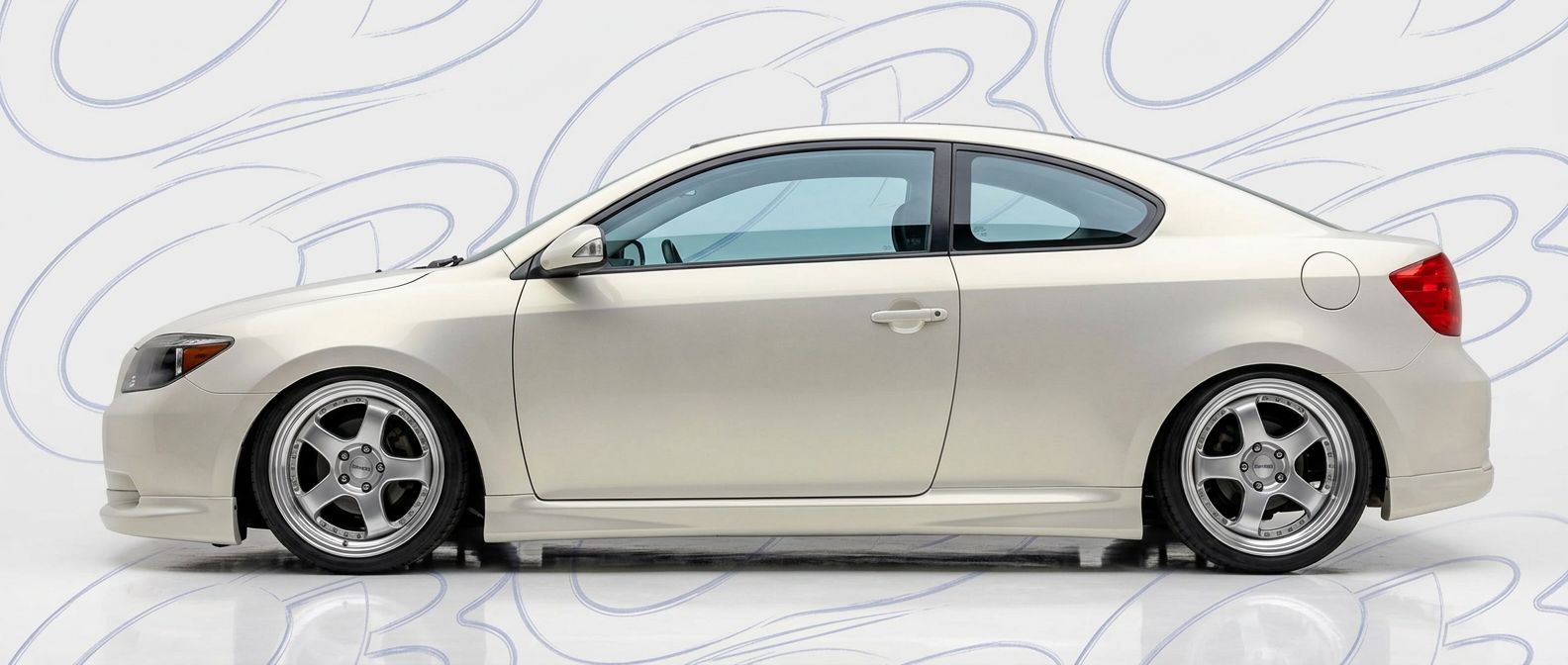 Top-tier 2006 Scion tC 2006 featuring a high-gloss finish and carbon fiber weave.
