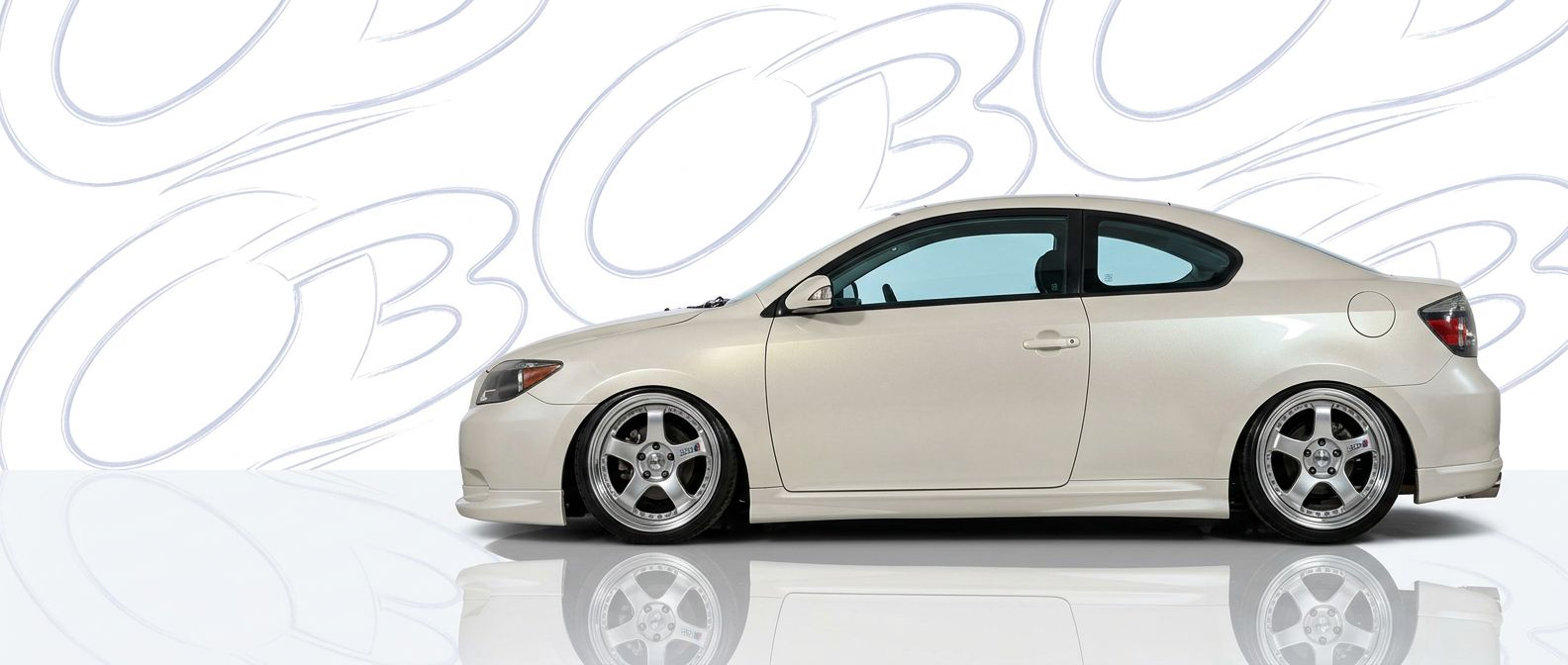 Top-tier 2009 Scion tC 2009 featuring a high-gloss finish and carbon fiber weave.