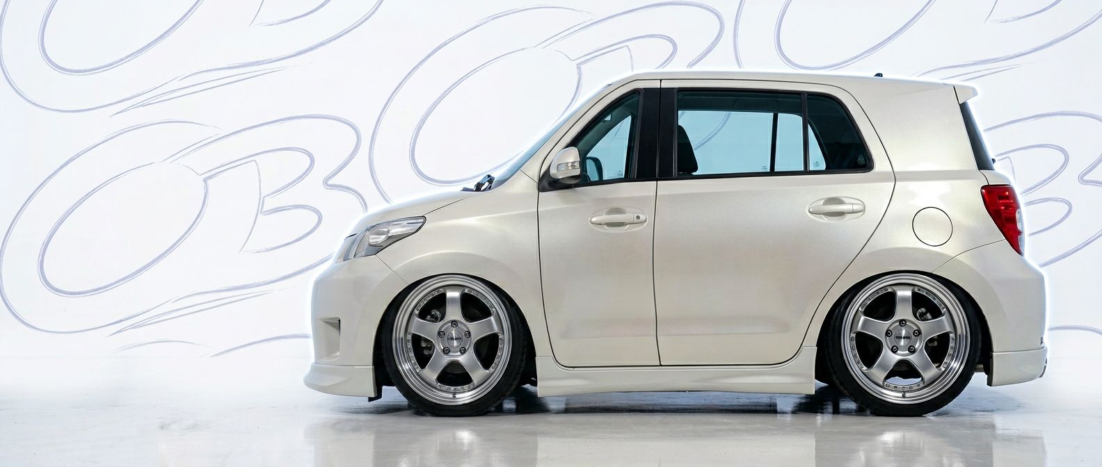 Top-tier 2002 Scion xD 2002 featuring a high-gloss finish and carbon fiber weave.