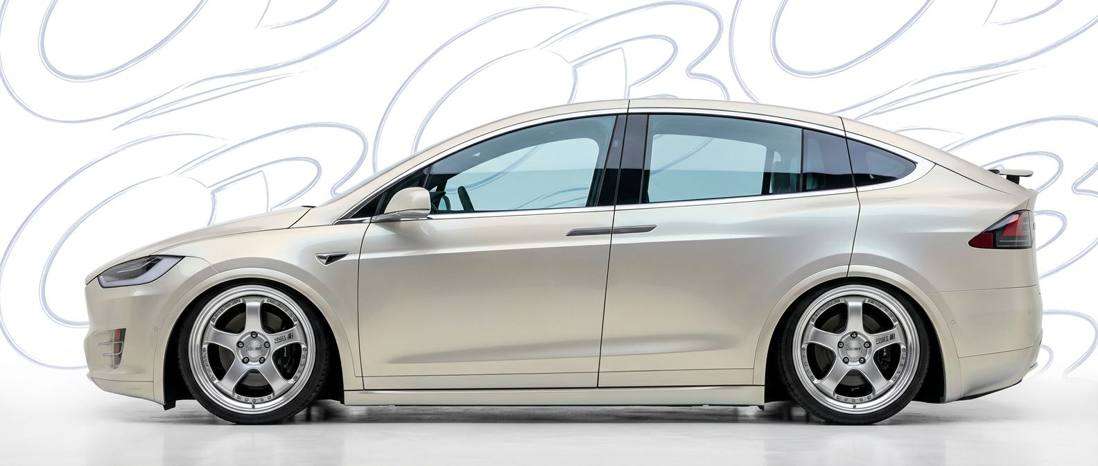 Top-tier 2022 Tesla X 2022 featuring a high-gloss finish and carbon fiber weave.